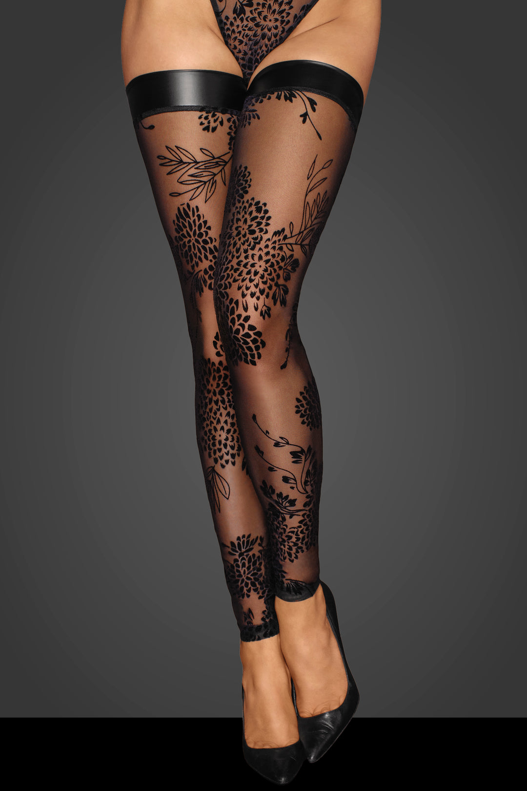 Tulle stockings with patterned flock embroidery and wetlook band at the top.